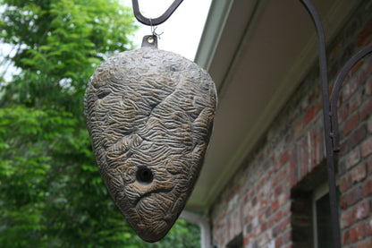 Weatherproof fake hornet nest designed for long lasting outdoor wasp deterrence